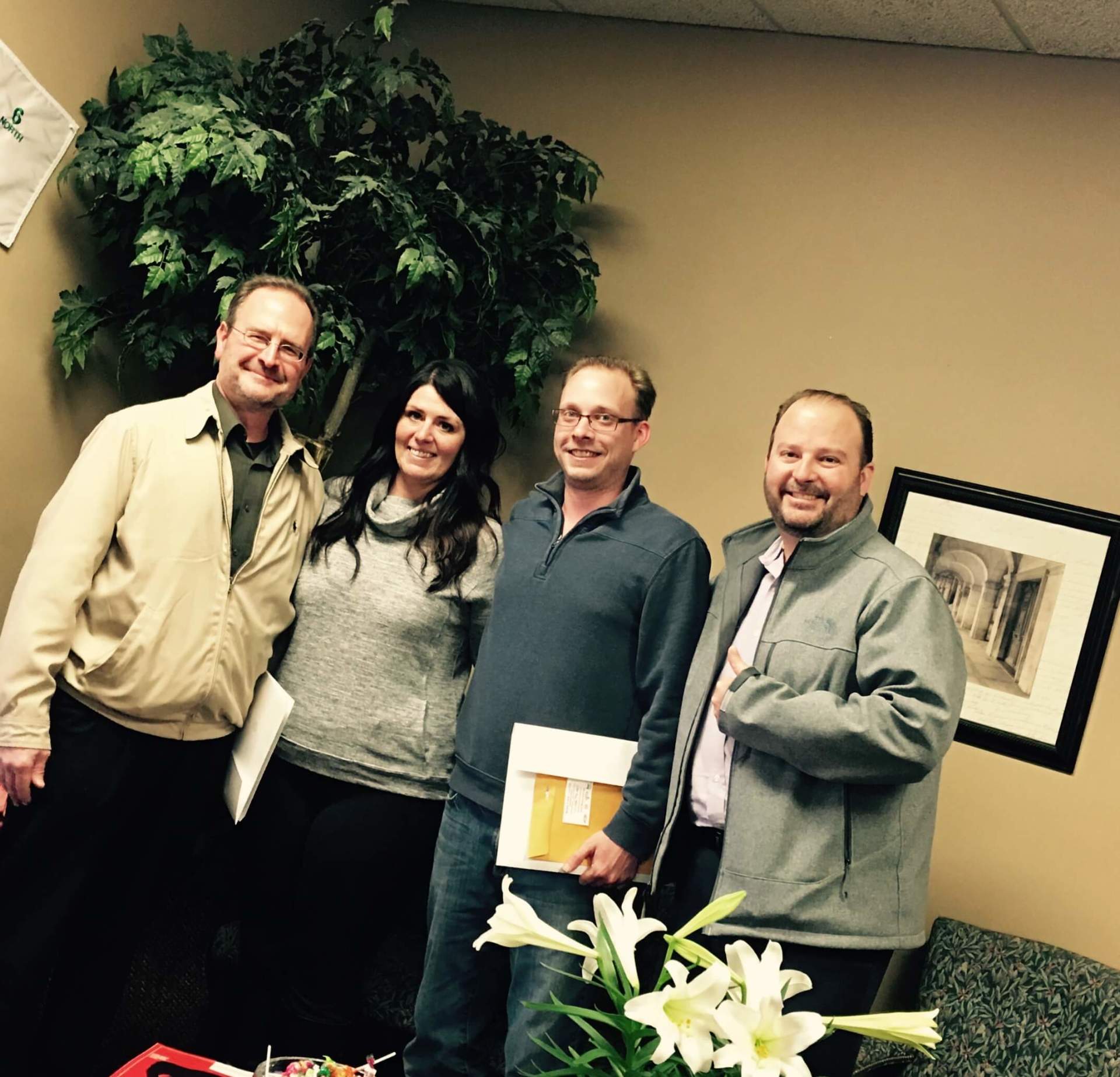 A group of people posing for a picture in a room