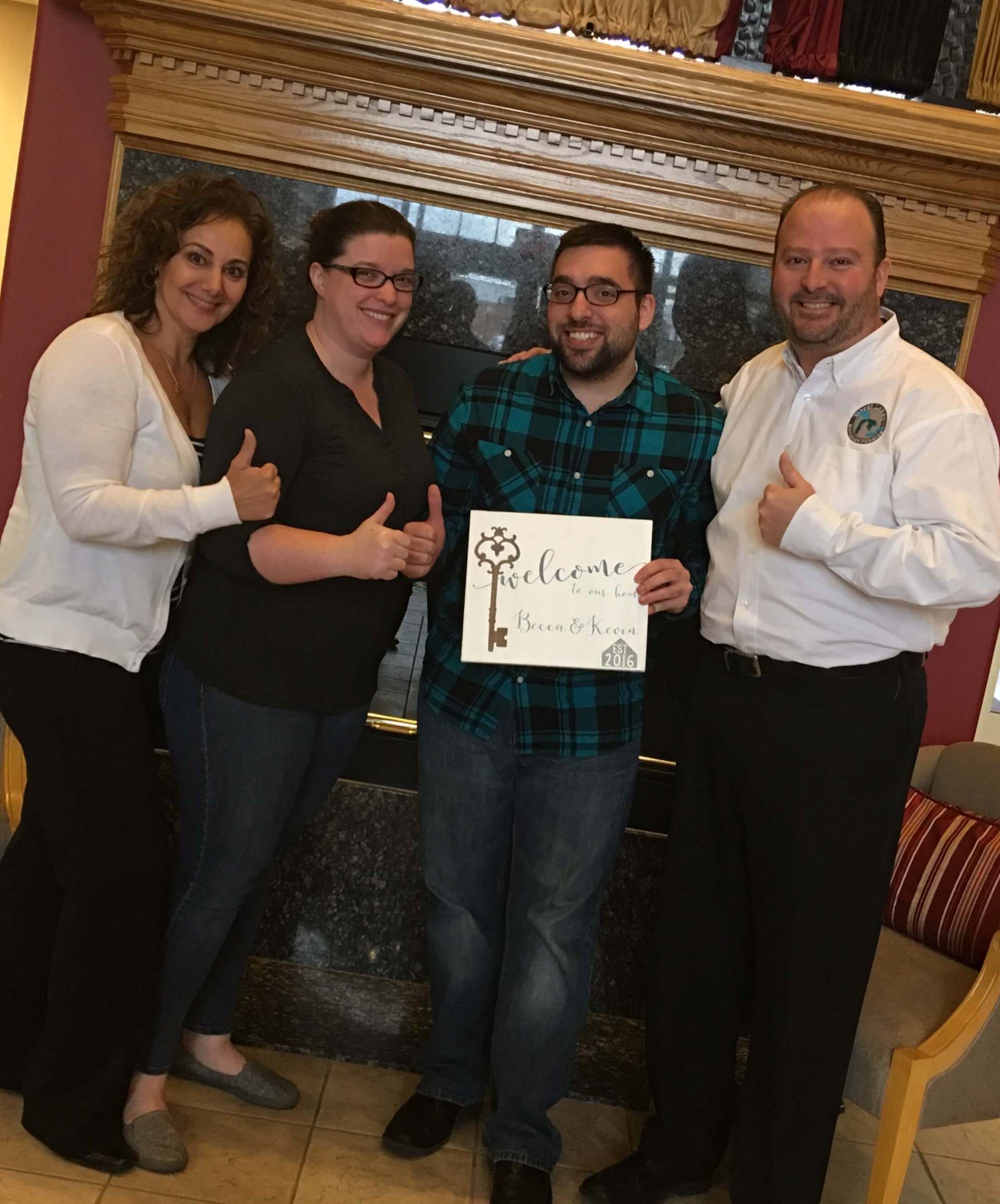 A man is holding a sign that says welcome.