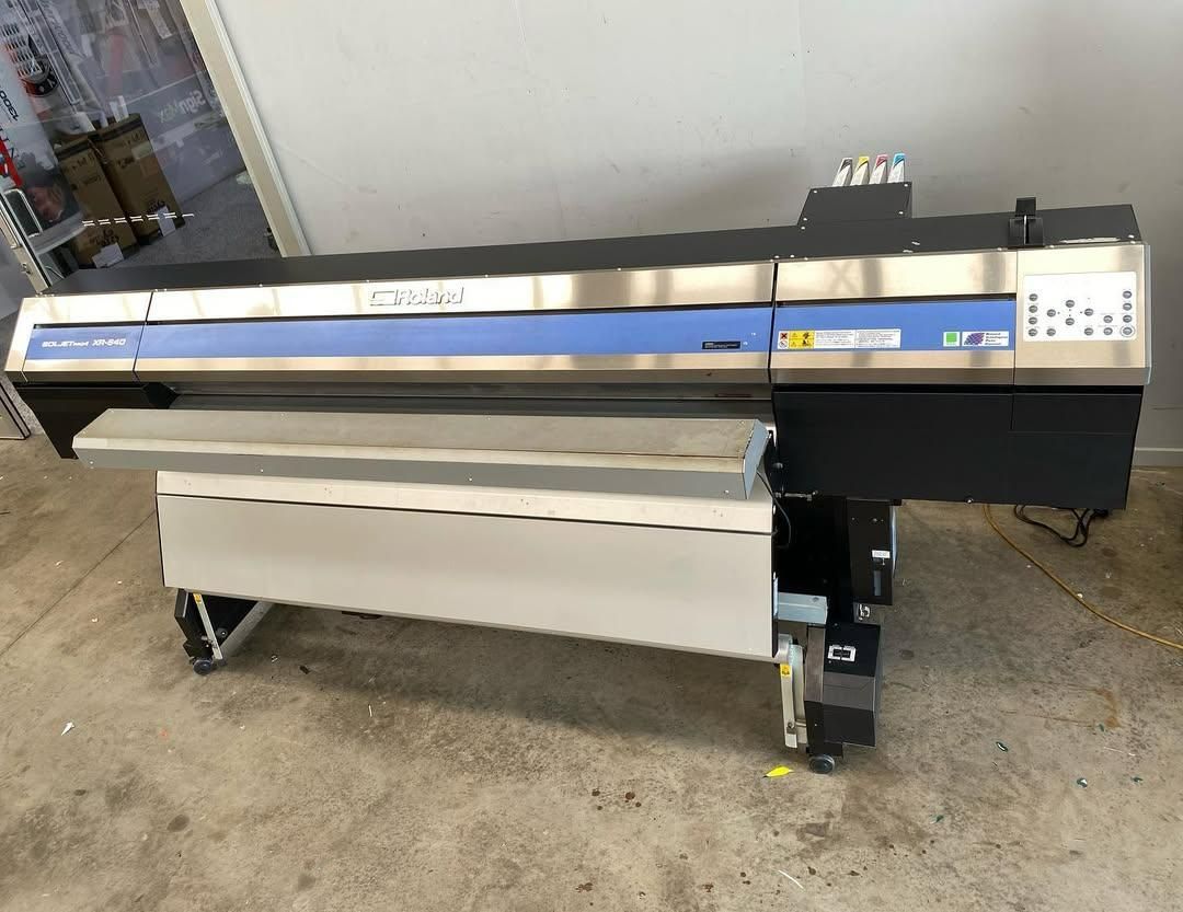 A Large Printer Is Sitting on The Floor in A Room — Signmax Bundaberg In Kensington, QLD