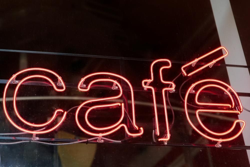 A Close up Of a Neon Sign that Says Cafe — Signmax Bundaberg In Kensington, QLD