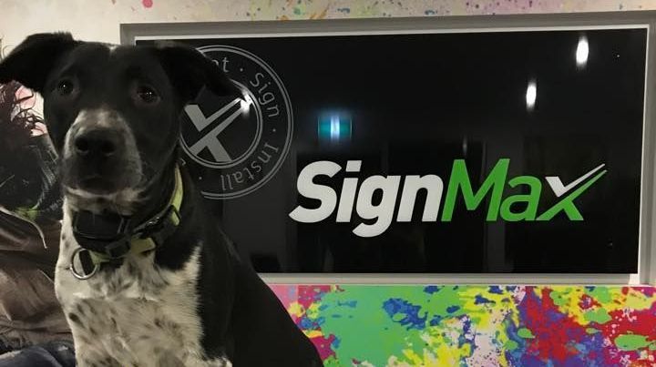 Worker on a Lift Repairs a Large Billboard — Signmax Bundaberg In Kensington, QLD