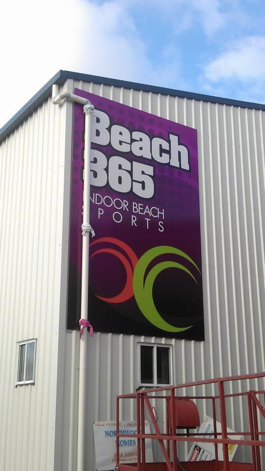 A Large Sign on The Side of A Building Says Beach 365 Indoor Beach Ports — Signmax Bundaberg In Kensington, QLD