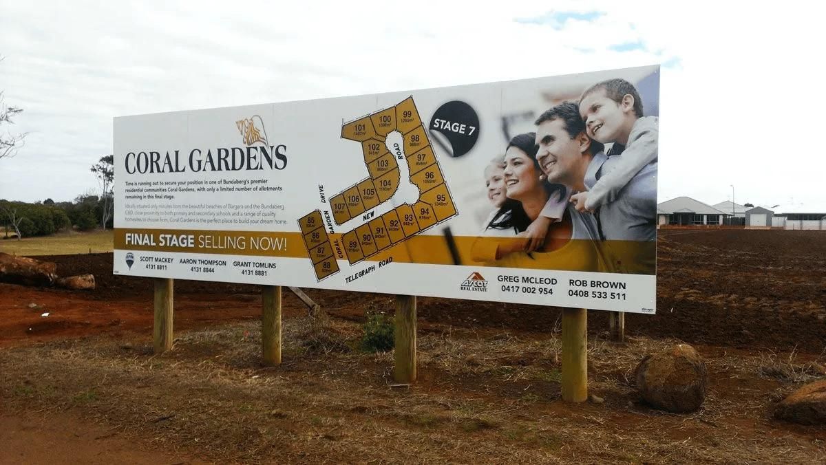 A billboard for coral gardens shows a group of people — Signmax Bundaberg In Kensington, QLD