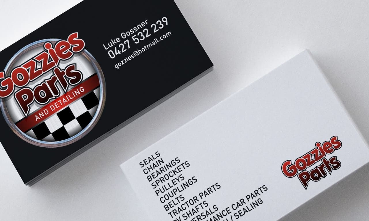 Stacked Business Cards Featuring a Red and Black Design — Signmax Bundaberg In Kensington, QLD