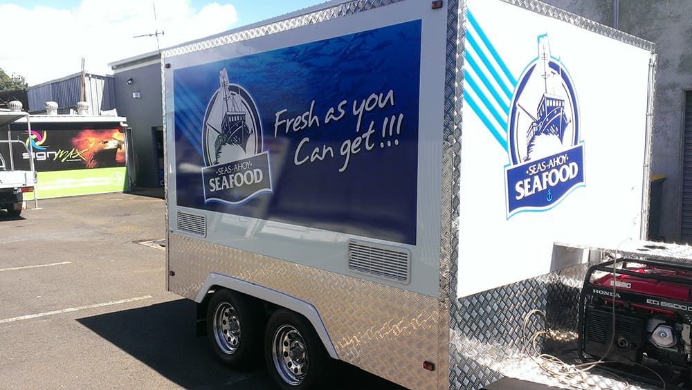 Seafood Trailer in Parking Lot With Logo and Slogan — Signmax Bundaberg In Kensington, QLD