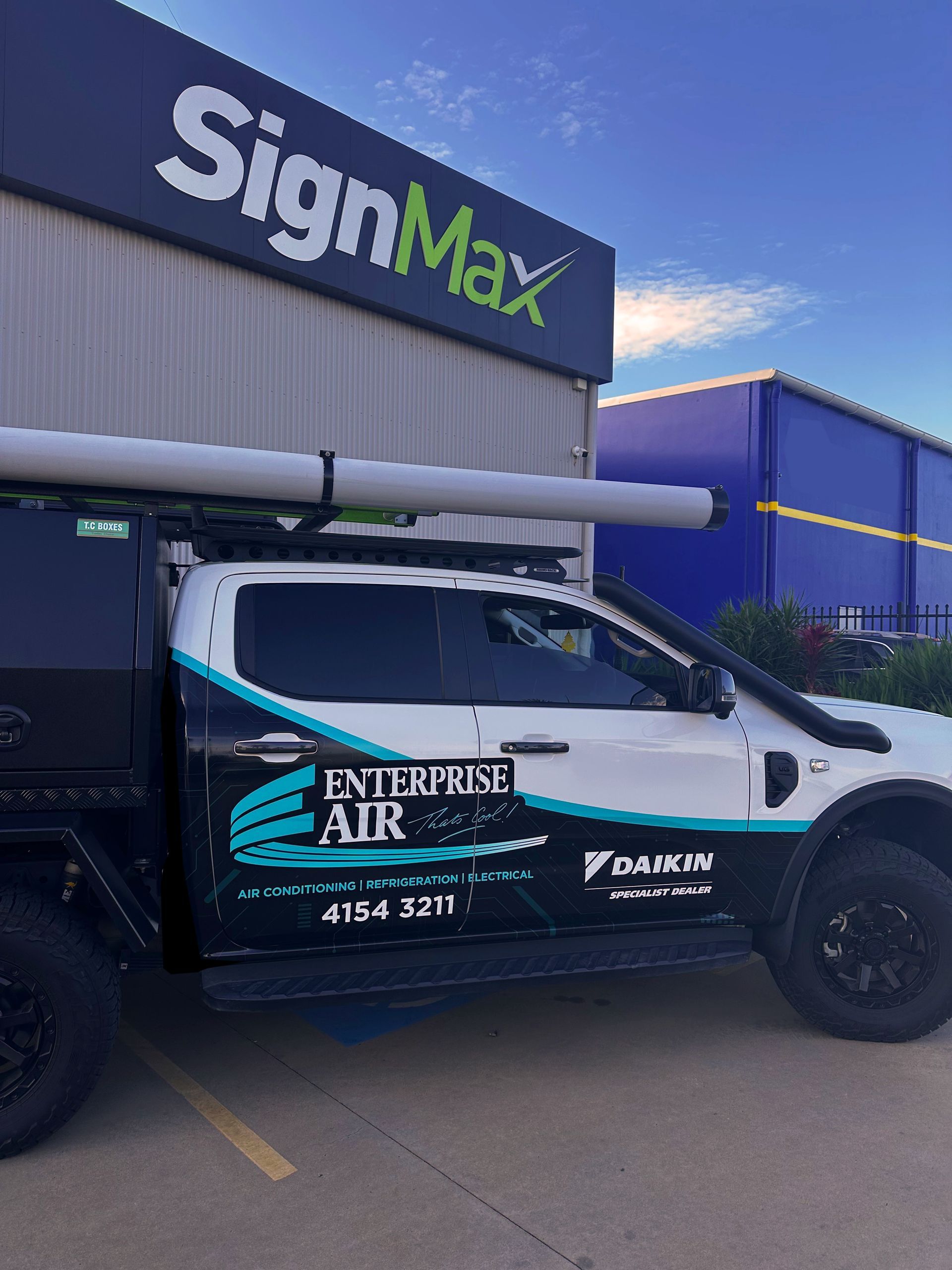 Black Van With Orange Graphics — Signmax Bundaberg In Kensington, QLD