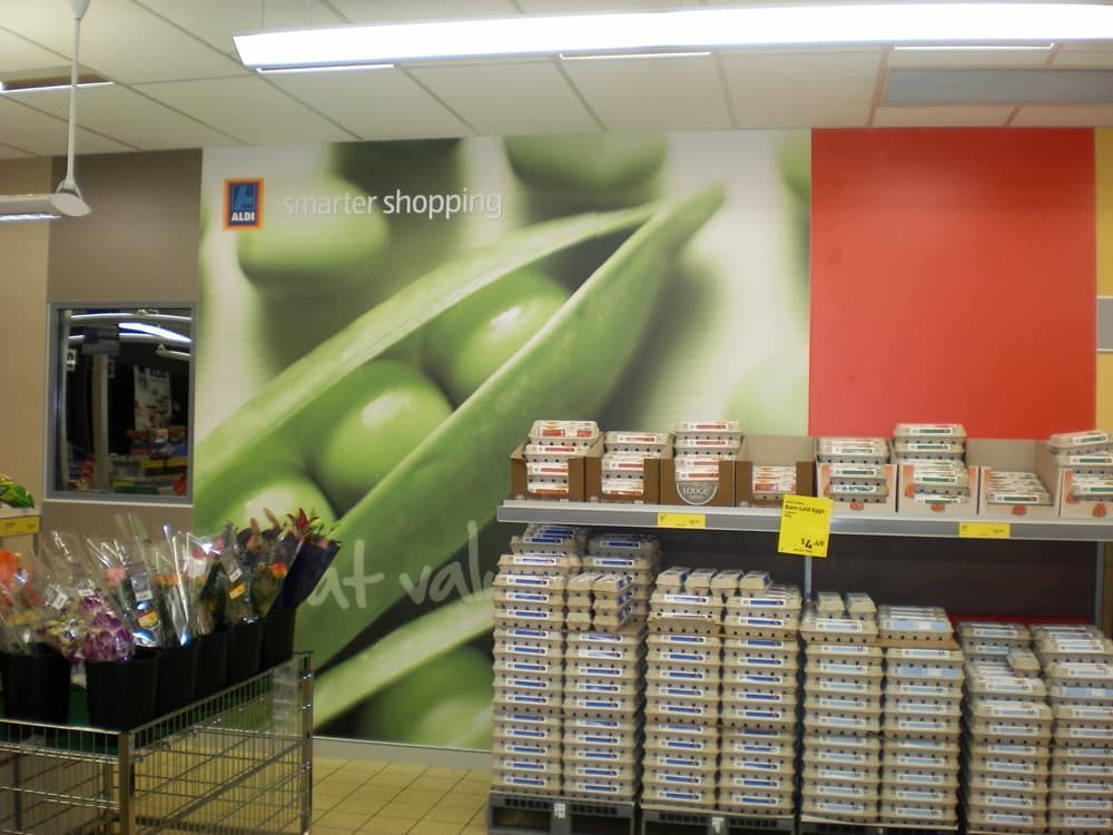 Grocery Store Interior With a Vibrant Pea Pod Mural on the Wall — Signmax Bundaberg In Kensington, QLD