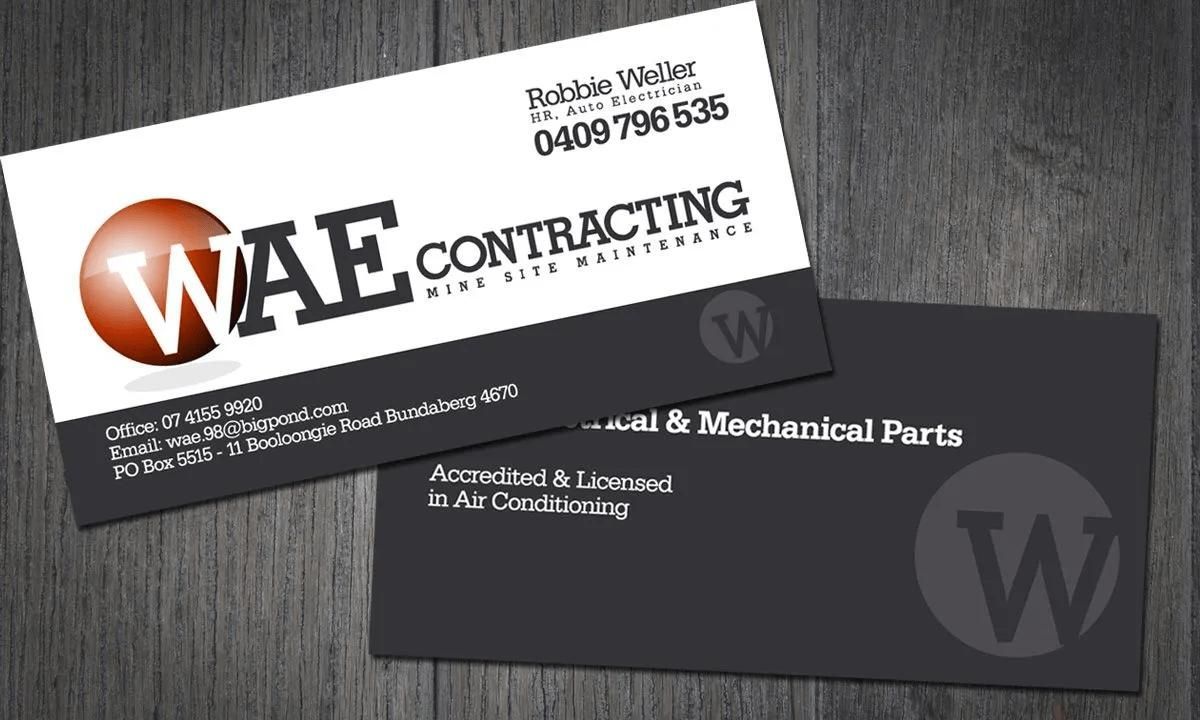 A Business Card for Wae Contracting Sits on A Wooden Table — Signmax Bundaberg In Kensington, QLD