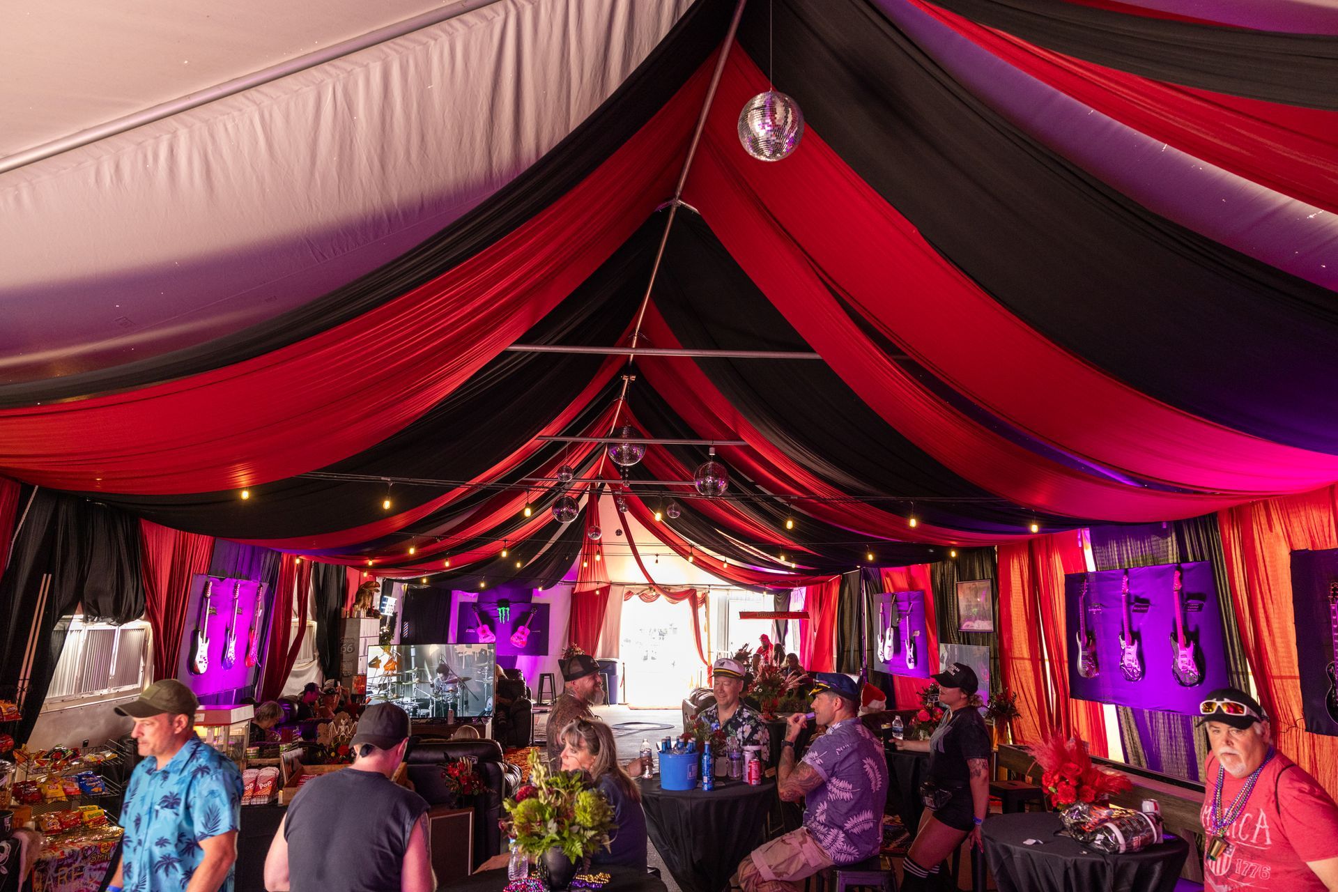 VIP tent with red and black decor