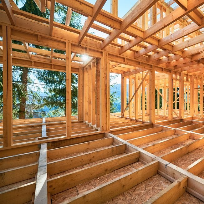 The inside of a wooden house under construction.