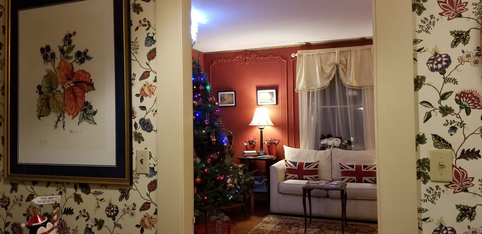 A living room with a couch and a christmas tree