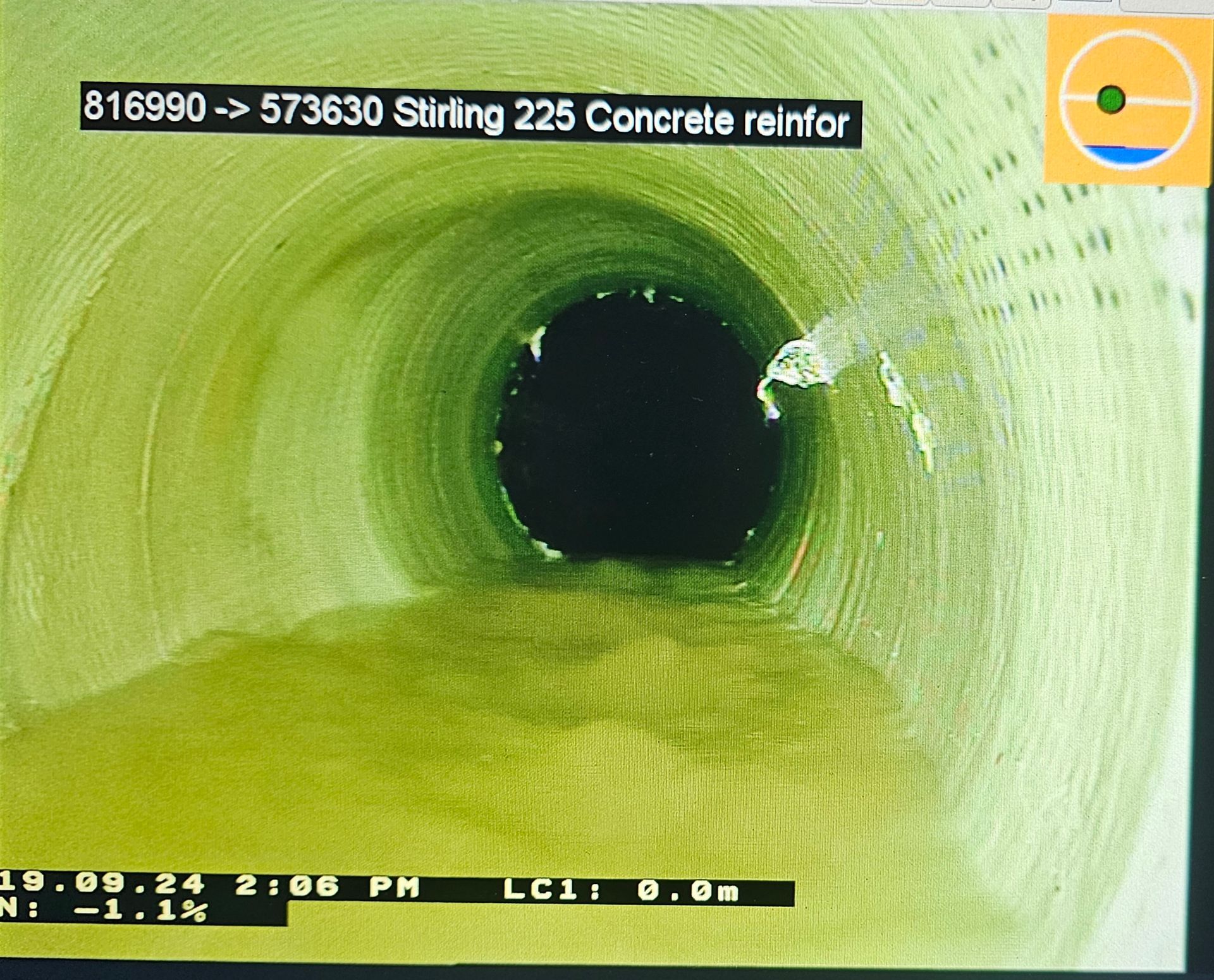 Inspection of a concrete pipe, showing its interior. The pipe is green-tinted, with a dark circular opening visible — Pro Pipe Solutions in Queanbeyan, NSW