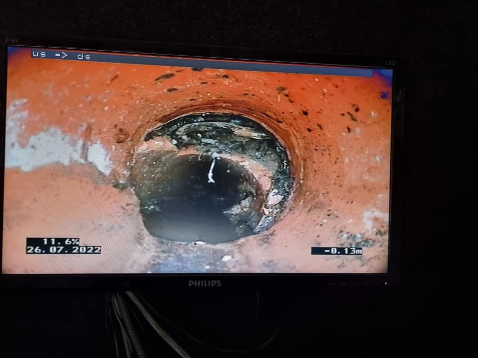 A Monitor Displays a Close-up of a Drain Pipe, Dark and Circular — Pro Pipe Solutions in Queanbeyan, NSW