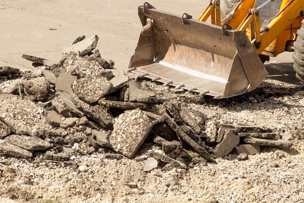 Bulldozer Scooping up a Pile of Rocks