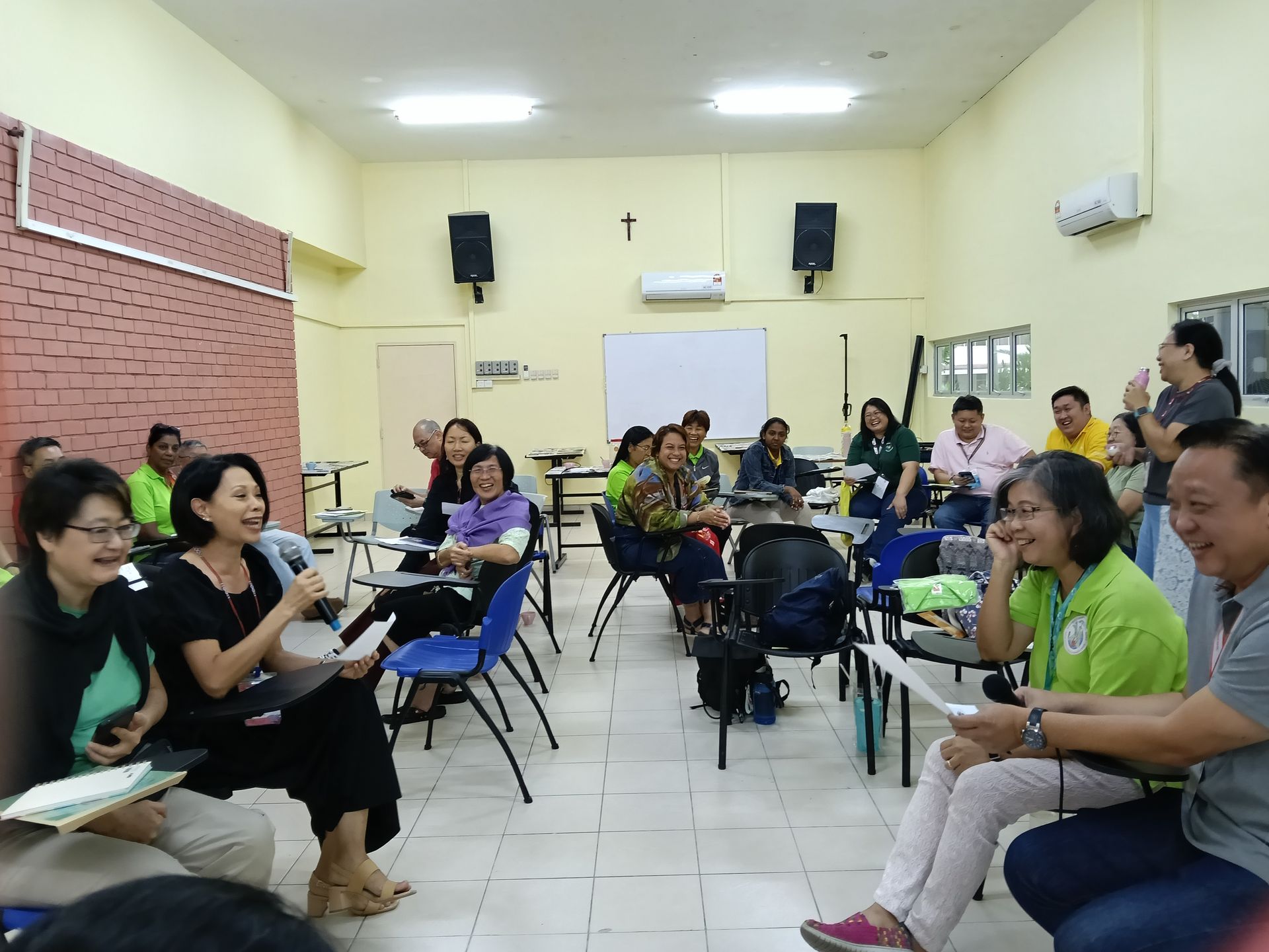 Men in church with altar; priest in white robes.