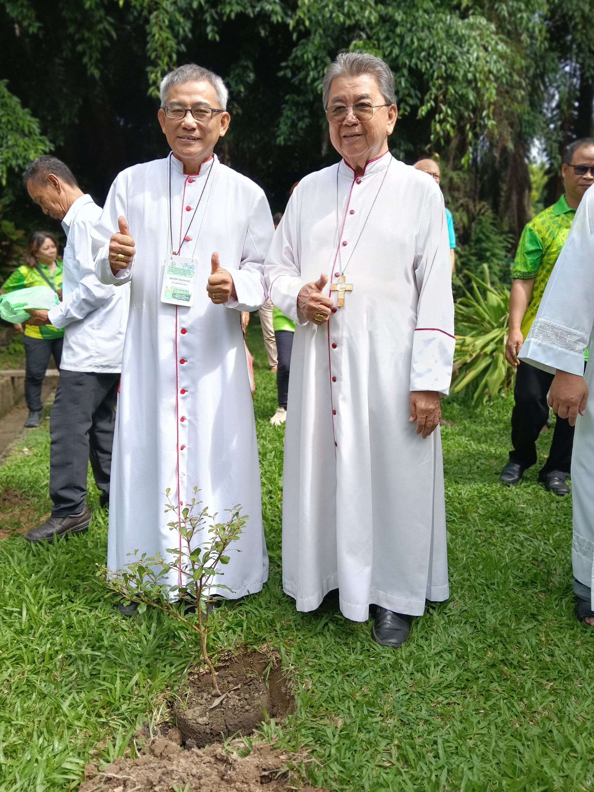Children embracing a globe, campaign banner: