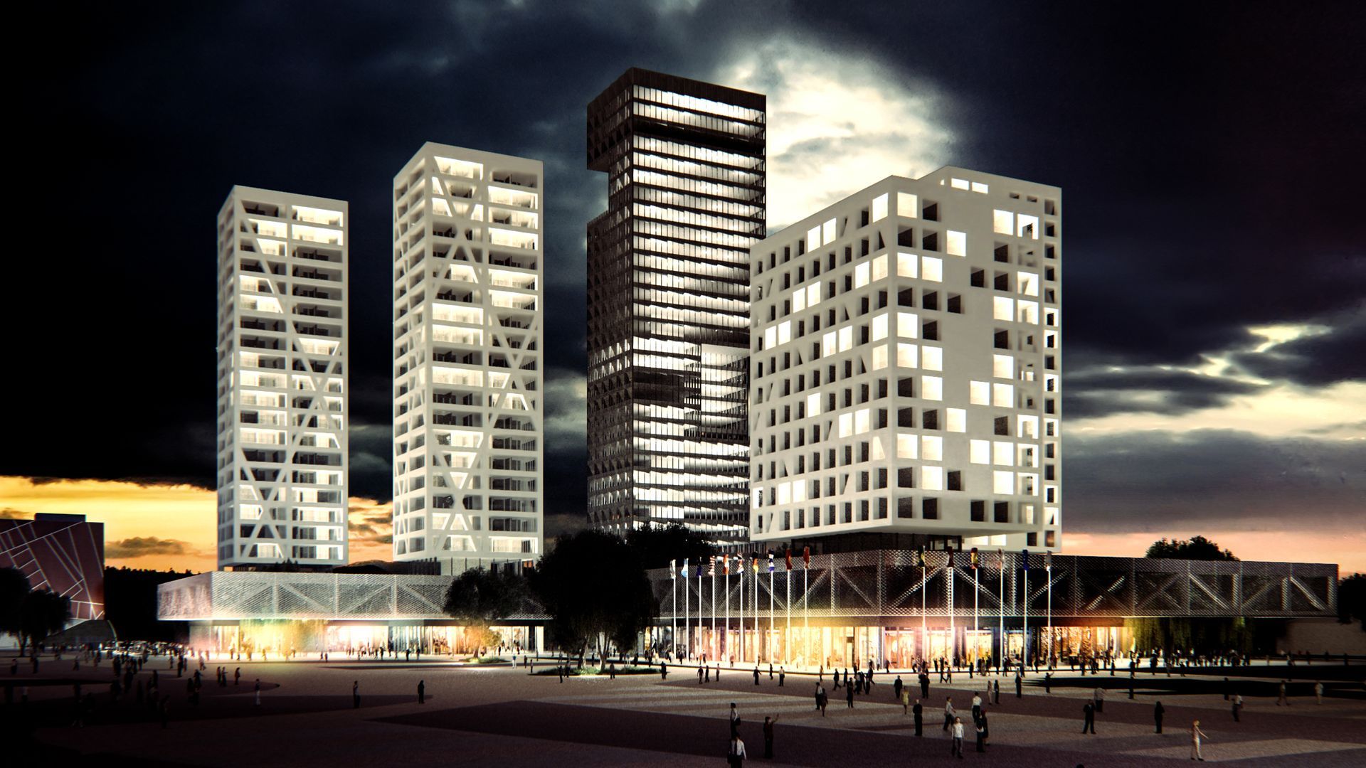 Rascacielos de noche con luces brillantes, una plaza y gente; cielo oscuro, arquitectura moderna.