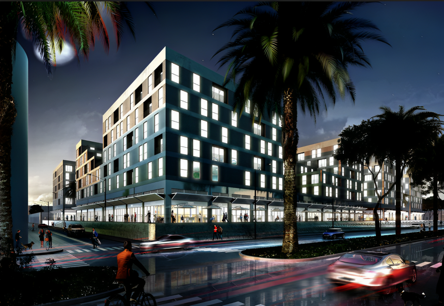 Edificio de apartamentos moderno por la noche con ventanas iluminadas, palmeras y coches pasando.