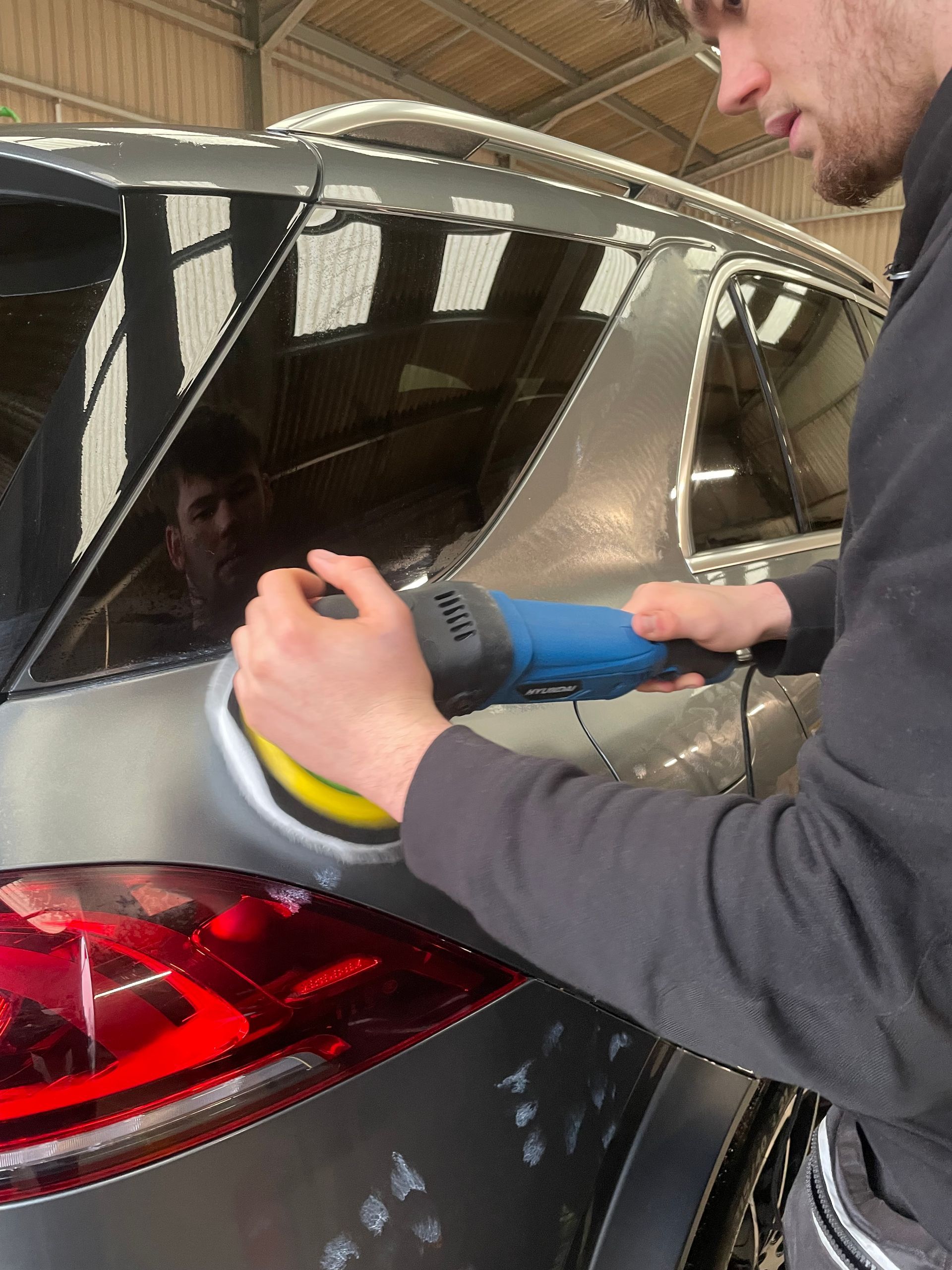 Grey Mercedes undergoing a machine polish paint correction