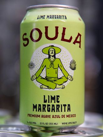 a can of soula lime margarita sits on a table