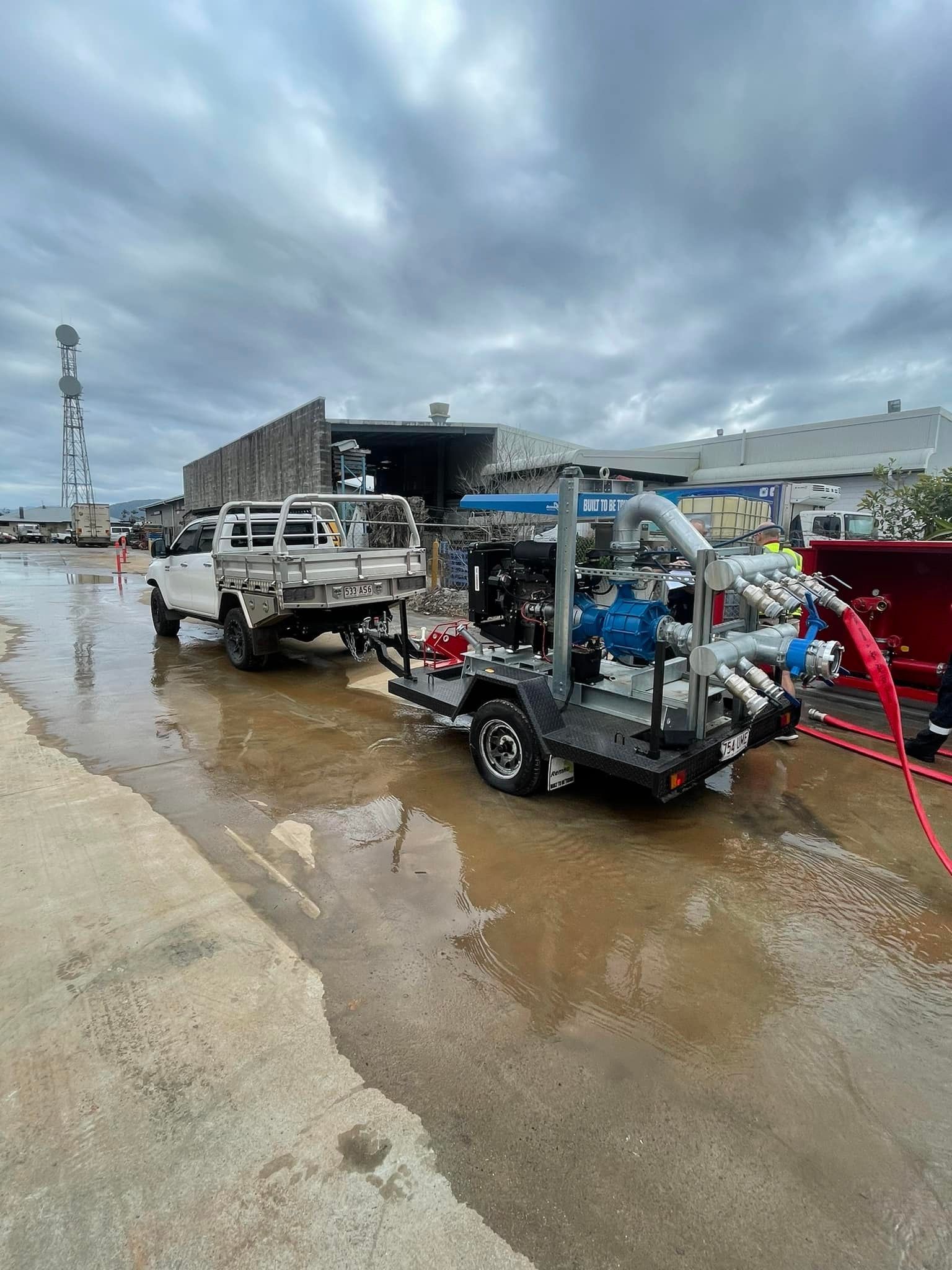 White Plumbing Pipe Leaking Water in a Cabinet, Splashing Downward — D & B Plumbing NQ in Trinity Beach, QLD