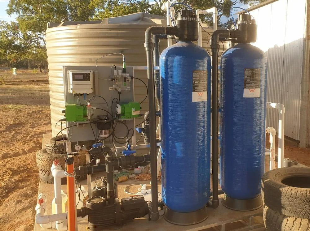 Water Treatment System With Large Blue Tanks — D & B Plumbing NQ in Kanimbla, QLD
