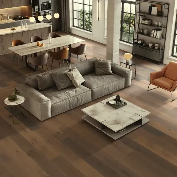 A living room with a couch , chairs , table and coffee table.