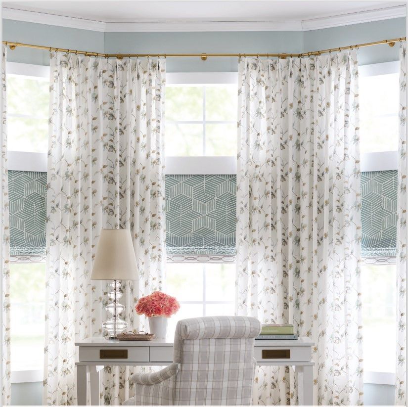 A room with a desk chair and a lamp