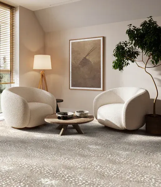 A living room with two chairs and a coffee table.