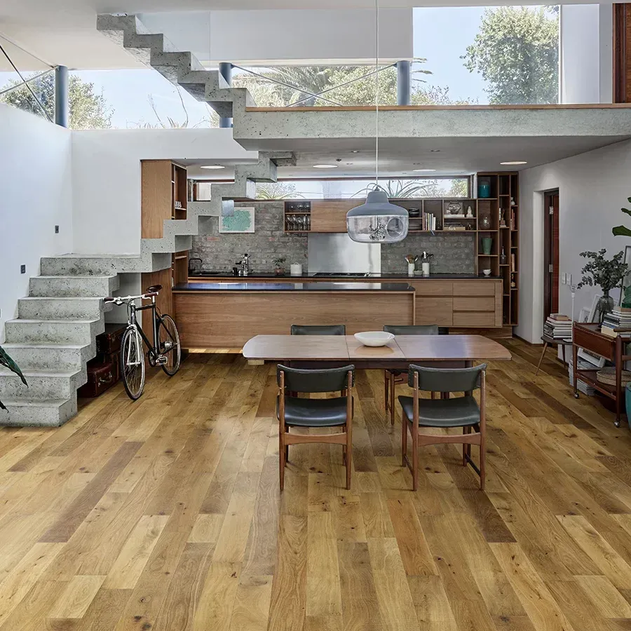 A kitchen with a table and chairs in it