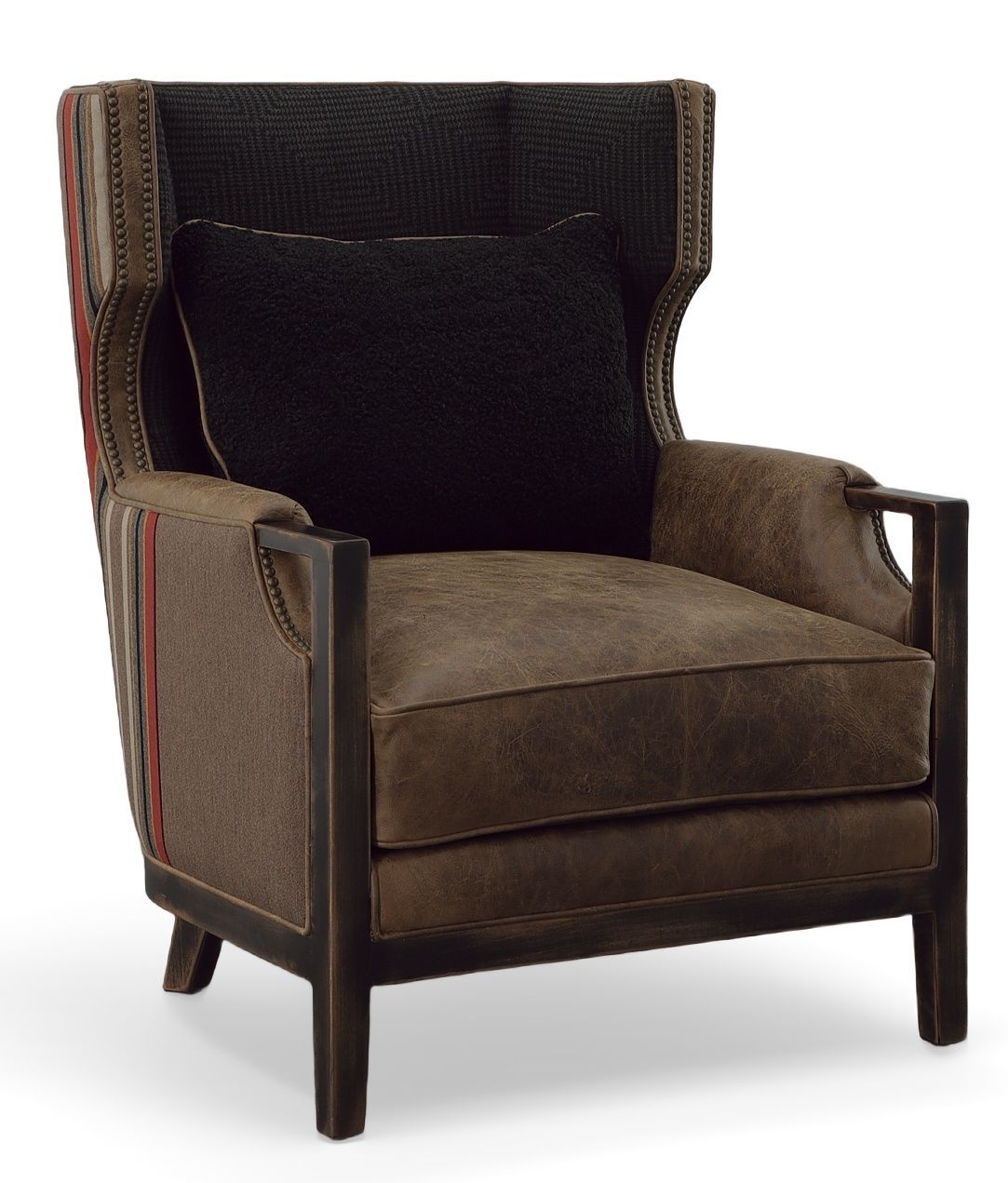 A brown chair with a black pillow on it
