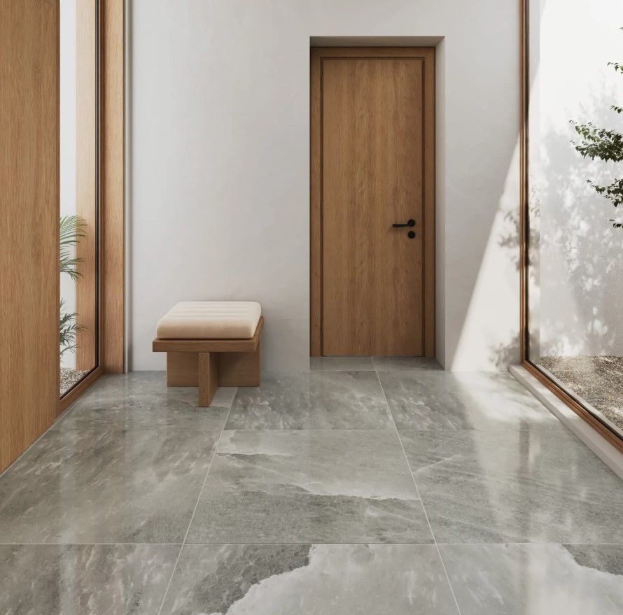 A hallway with a wooden door and a bench