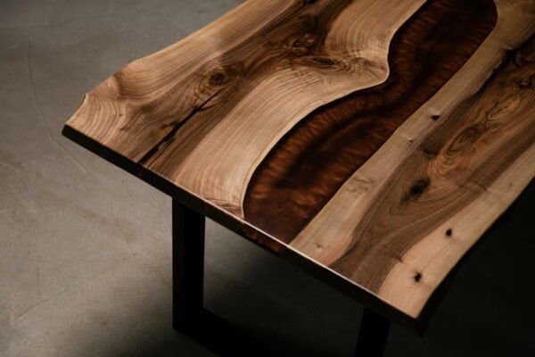 A wooden table with a river in the middle of it.