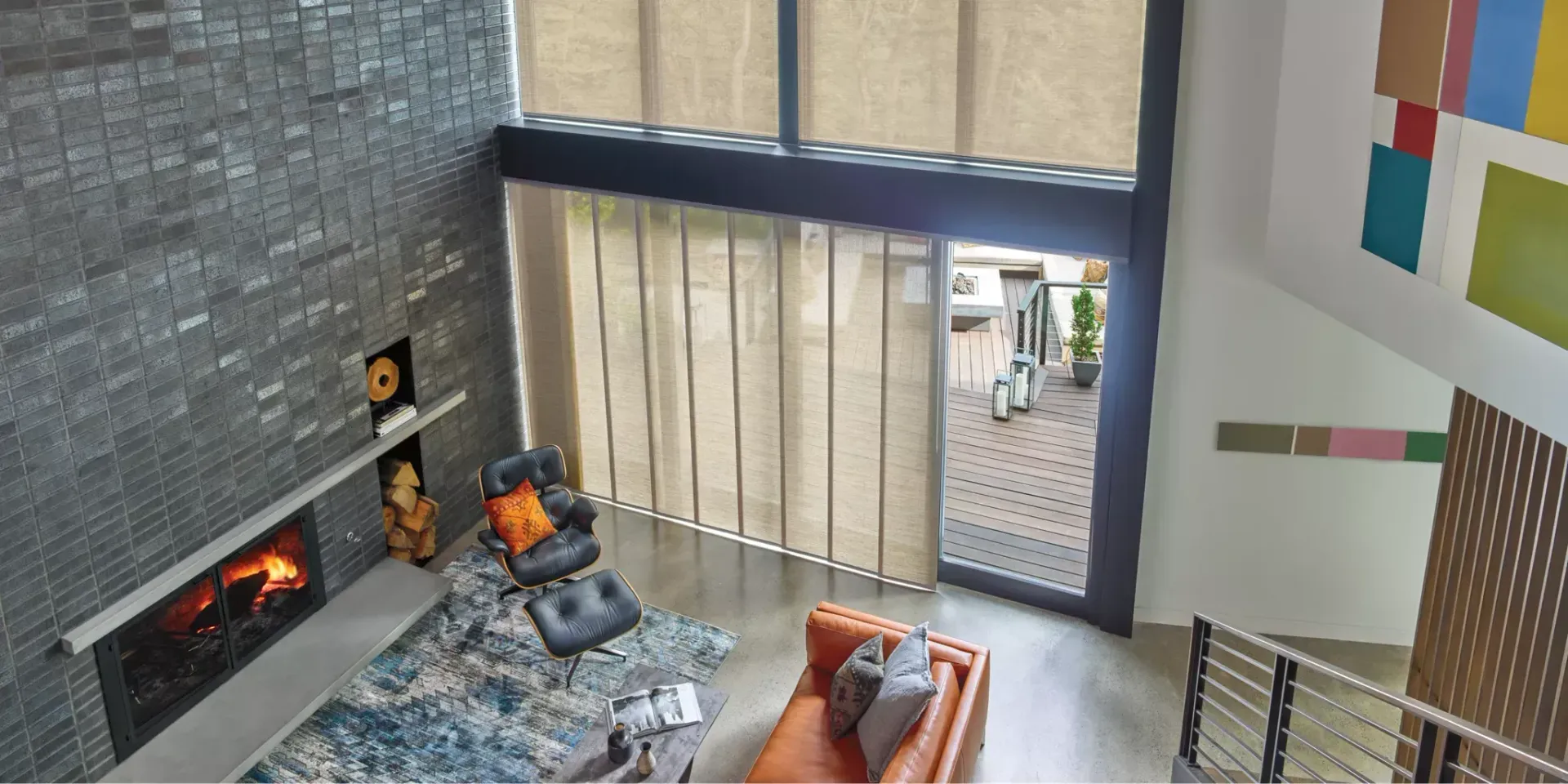 An aerial view of a living room with a fireplace and a couch.