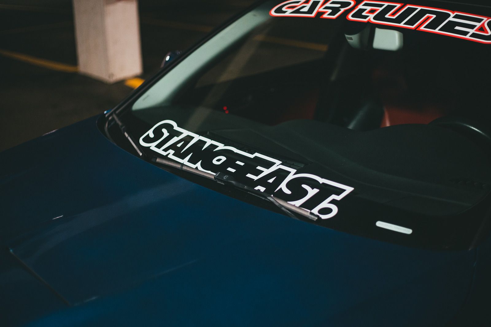 A car with a sticker on the windshield that says stance eagle