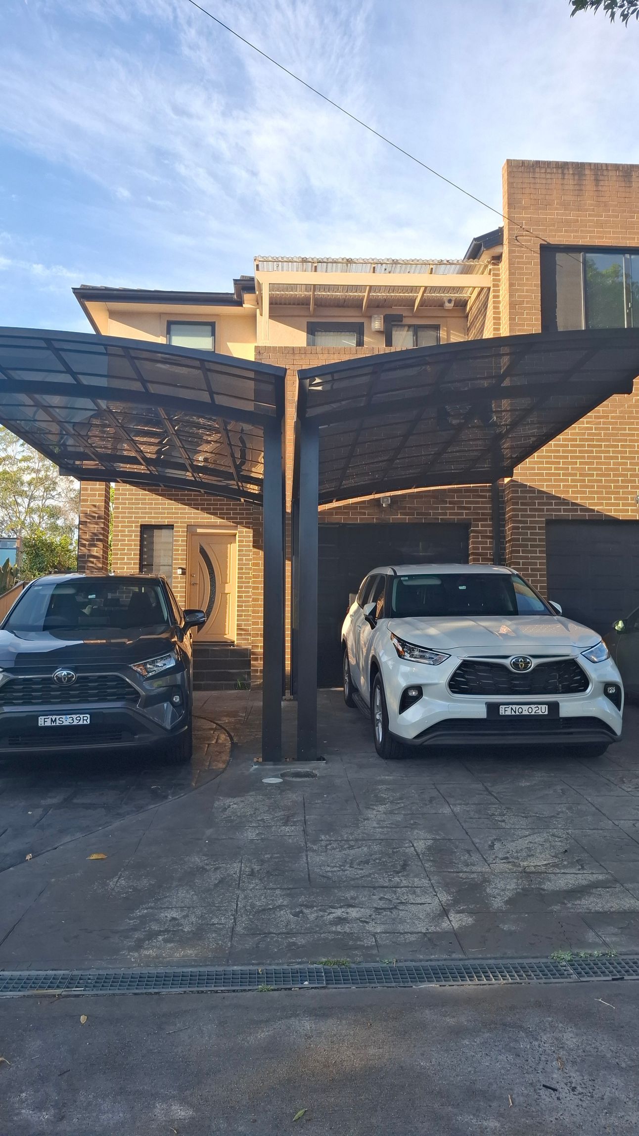 A man is working on a pipe in the dirt.