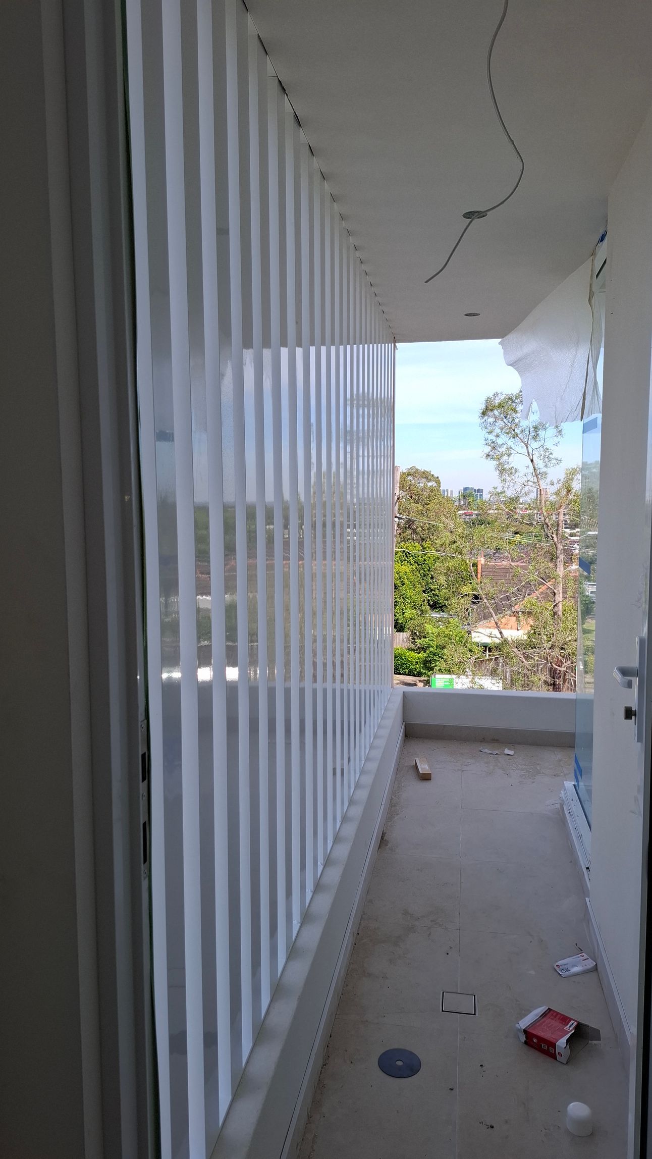 Two men are working on a pipe in the dirt.