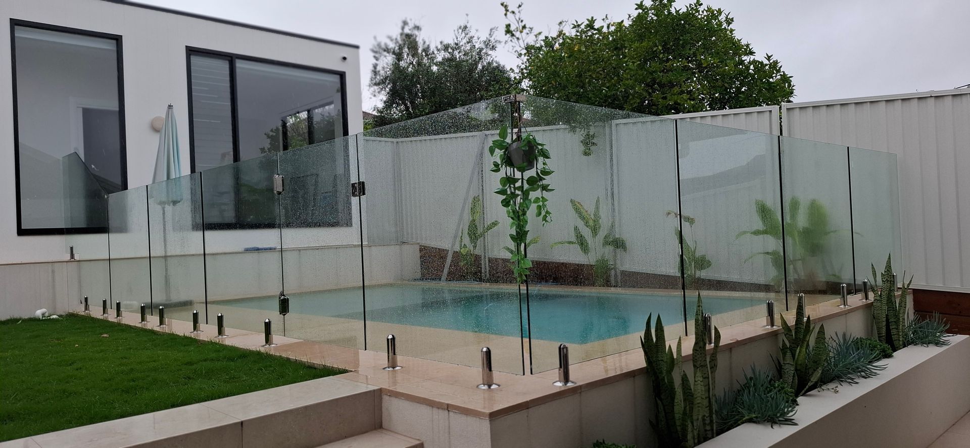 A group of construction workers are pouring concrete into a steel structure.