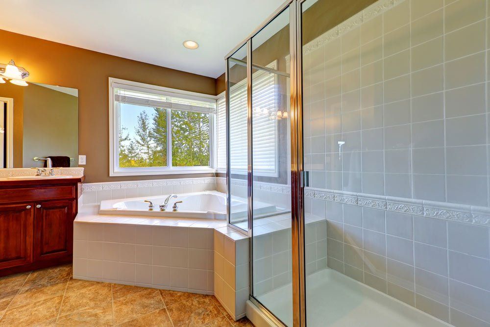 Bathroom Interior With Corner Bath Tub And Screened Shower — B&A Doors In Mermaid Waters Queensland