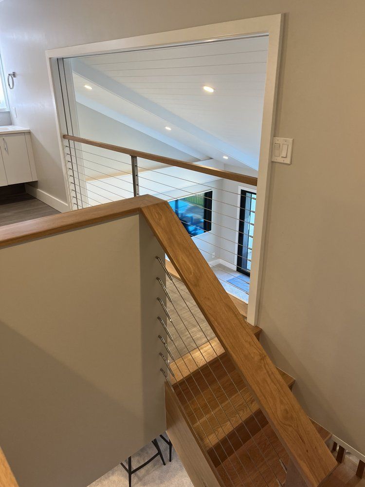 A hard hat is sitting on top of a wooden table.