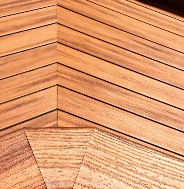 A hallway with stairs and cabinets underneath them.