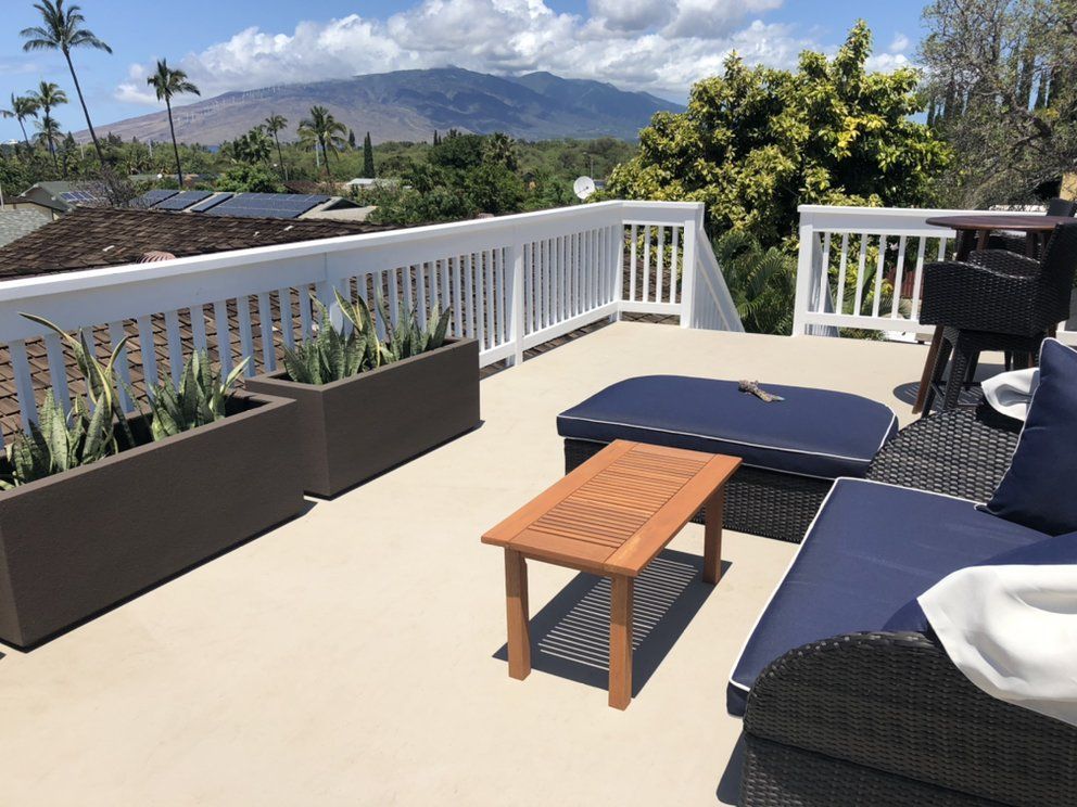 A hallway with stairs and cabinets underneath them.