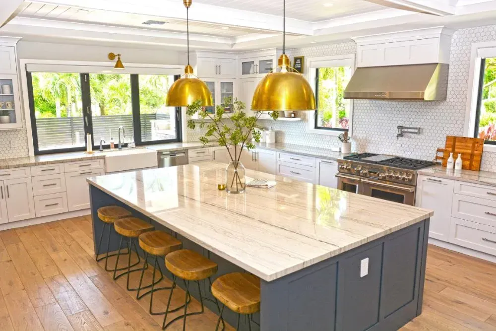 There is a large island in the middle of the kitchen.