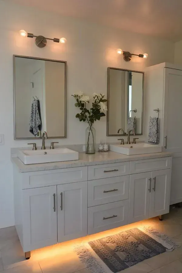 A bathroom with two sinks and two mirrors