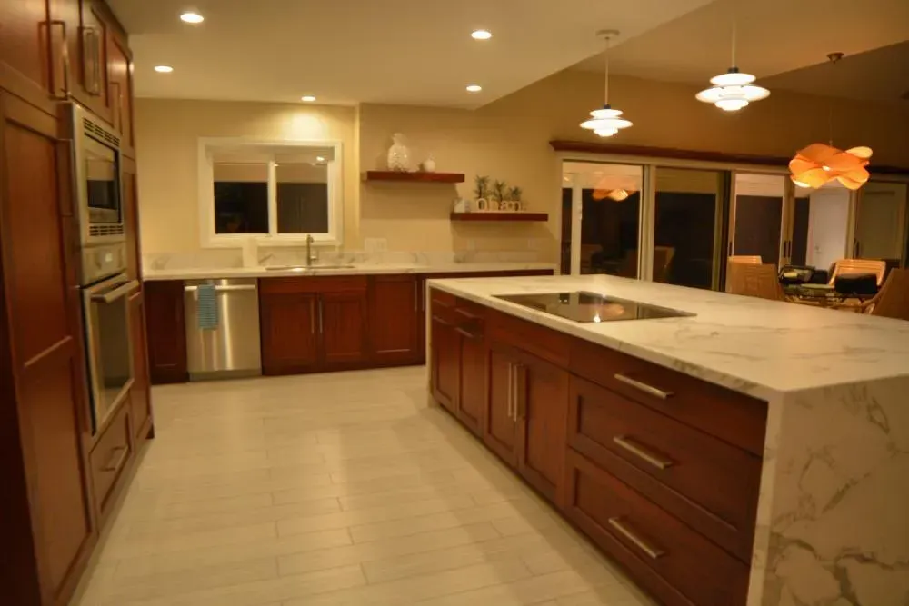 A kitchen with stainless steel appliances and wooden cabinets