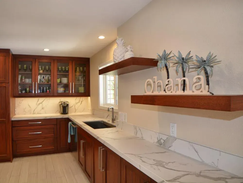 A kitchen with a shelf that says ohana on it
