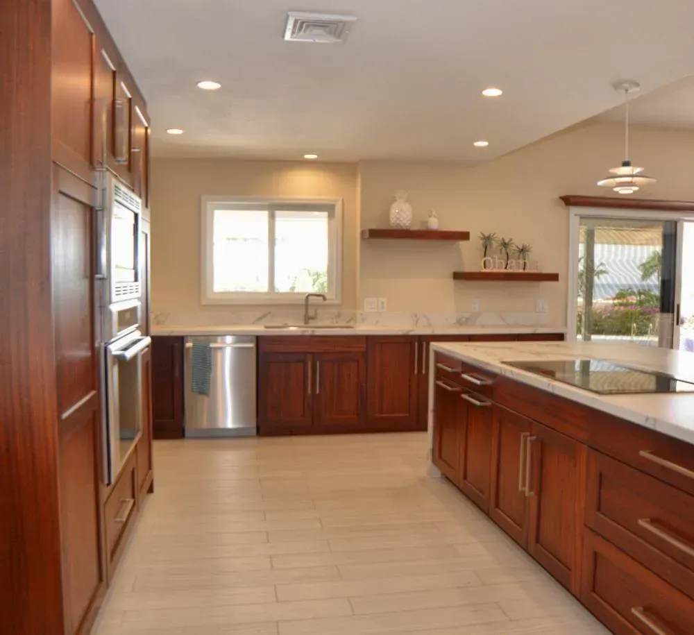 A kitchen with wooden cabinets and stainless steel appliances