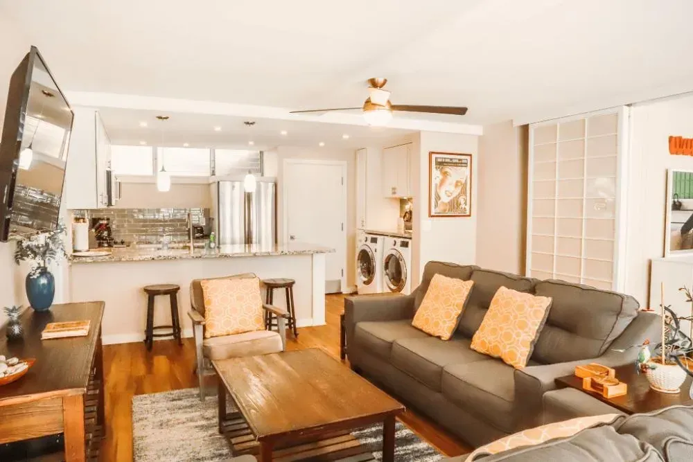 A living room filled with furniture and a flat screen tv.