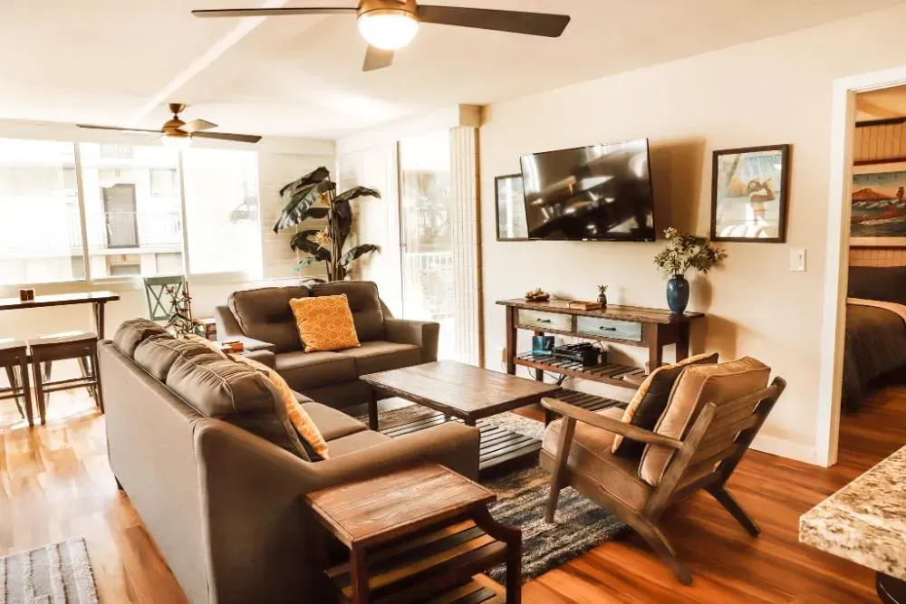 A living room filled with furniture and a flat screen tv.