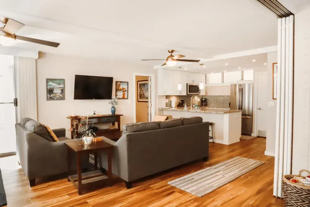 A living room filled with furniture and a flat screen tv.